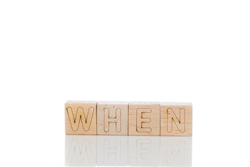 Wooden cubes with letters when on a white background