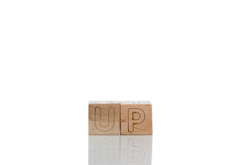 Wooden cubes with letters up on a white background