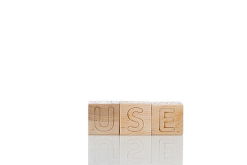 Wooden cubes with letters use on a white background
