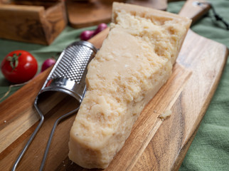 One piece of authentic Parmigiano-Reggiano or Parmesan Italian hard, granular cheese