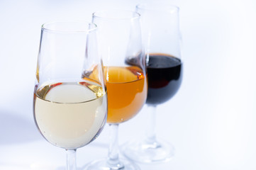 Fortified wine from Andalusia, Spain, different types of sherry in glasses on white background