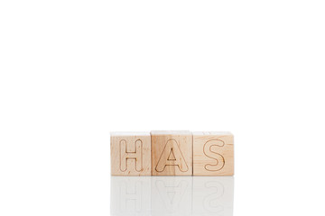 Wooden cubes with letters has on a white background
