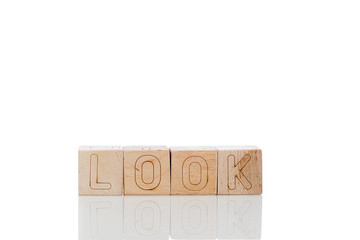 Wooden cubes with letters look on a white background