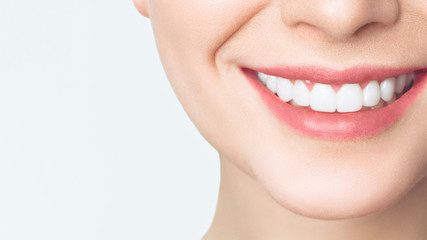 Perfect healthy teeth smile of a young woman. Teeth whitening. Dental clinic patient. Image...