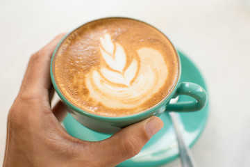 Café con leche con arte latte