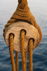 Close up of a traditional wooden hoist and rope from an old sailing ship