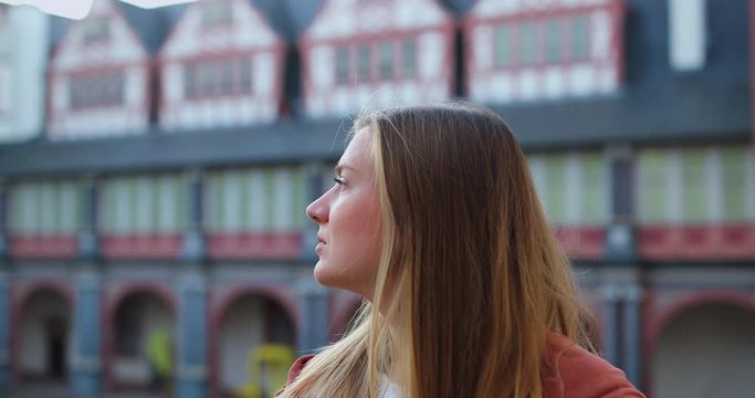 Young Woman make selfie and smile in old german city