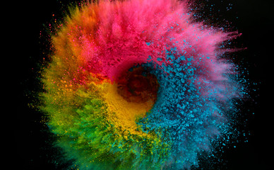 Coloured powder explosion on black background
