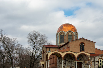 A Gold Domed Church Against a Cloudy Sky