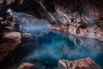 cave with blue geothermal pool - obrazy, fototapety, plakaty