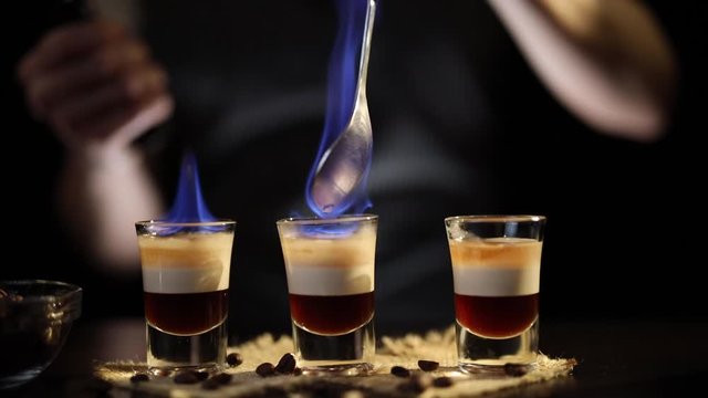 Bartender burning B-52 cocktail