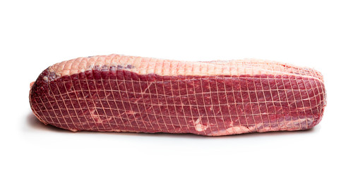 netted pack of raw meat package isolated on white background