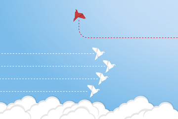 Think differently concept. Be different. Red bird changing direction. New idea, change, trend, courage, creative solution, innovation and unique way concept	