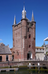 Fototapeta na wymiar Gothic Zuidhavenpoort city gate with its brick tower in the old town of Zierikzee, Netherlands