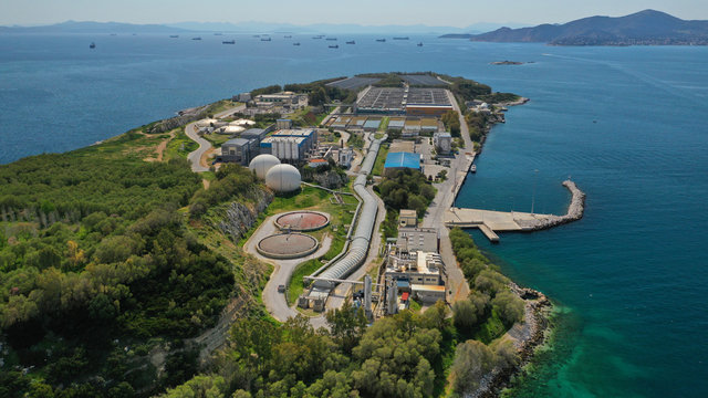 Aerial drone photo of small island of Psitaleia a latest technology industrial sewage plant near port of Piraeus, Attica, Greece