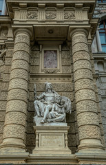 Decorative marble sculptures and columns on the facade of the building of the National Museum of Natural History in the building of the Hofburg Palace in Vienna, Austria