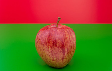 red apple  on green  background