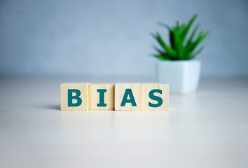 Bias - word from wooden blocks with letters, personal opinions prejudice bias concept, random...