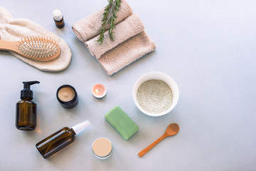 Obraz na płótnie Canvas Top view hygiene items and natural cosmetics on light gray background.