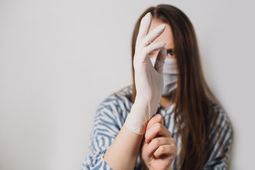 Fototapeta premium girl squeezes liquid soap on her hand. quarantine. prevention of coronavirus. corona virus prevention. scientist in biological protective Epidemic virus outbreak concept. COVID-19