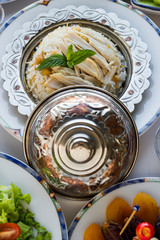Detail Shooting of Ramadan Dinner Table chicken and rice in vintage copper plate. Conceptual image of Ramadan Feast.