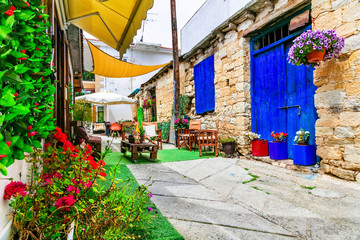 Fototapeta na wymiar Charming streets with cute cafe bars in old traditional villages of Cyprus island