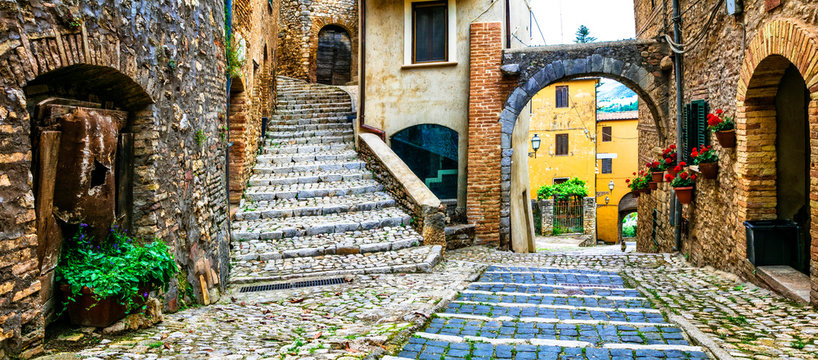 Fototapeta Traditional medieval villages of Italy - picturesque old floral streets of Casperia, Rieti province