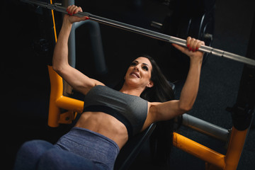  Fitness woman on training. Young woman in the gym.