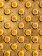 Yellow blind crosswalk pattern sidewalk