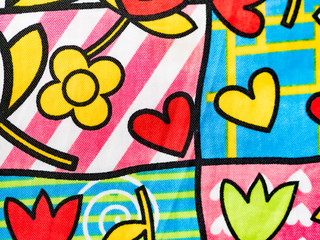 Original fabric background, with drawings of flowers and hearts.