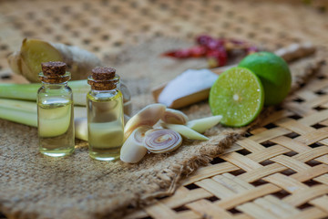 Lemongrass essential oils placed on a wooden table. spa concept.