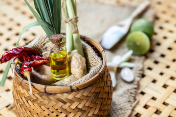 Lemongrass essential oils placed on a wooden table. spa concept.