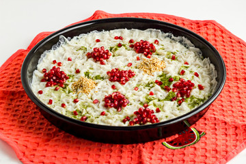 Ready to serve Traditional Turkish Ramadan Dessert; Gullac is in black tray on the kitchen cloth.
