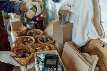 Female in gloves working in a flower shop