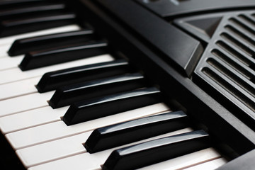 Synthesizer keys closeup background, toned