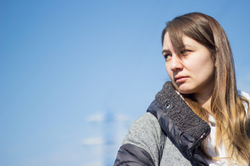 Beautiful girl with long curly hair outdoors