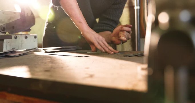 Bladesmith carving blade on steel