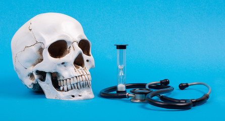 The flu virus epidemic. Human life and death from the virus. Human skull with phonendoscope and...