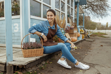 Smiling worker with a pair of gloves