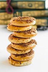 Traditional Turkish Kandil Sesame Rings  which is eaten on Kandils.Kandil is one of the five Islamic holy nights :Mevlid,Regaip,Mirac,Berat,Kadir. Sesame rings with tea on white.