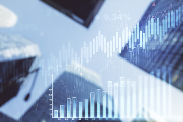 Double exposure of abstract financial graph on office buildings background, financial and trading concept