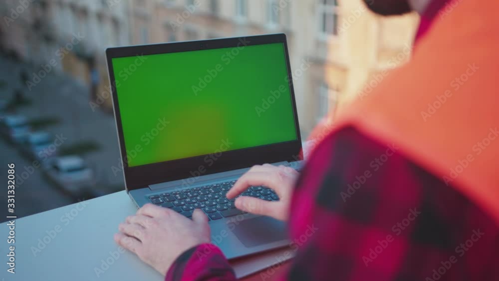 Wall mural man hands engineer using laptop computer with green screen on balcony worker project occupation buil
