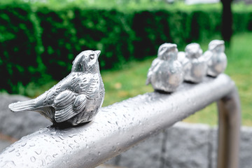 Bird metal sculpture under rain, Osaka, Japan