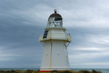 Fototapeta na wymiar lighthouse on coast of the sea