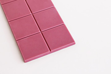The fourth type in chocolate: Ruby on the white surface with large copy space.