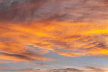 Fototapeta premium Colorful dramatic sky at sunset with pasted clouds