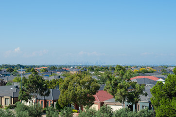 Aerial view of residential houses in Melbourne's suburb. Elevated view of Australian homes against blue sky. Copy space for text. Point Cook, VIC Australia.