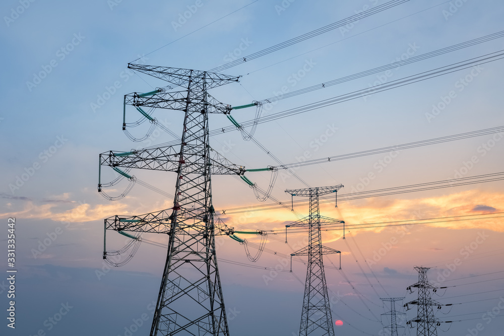 Poster transmission line tower in sunset