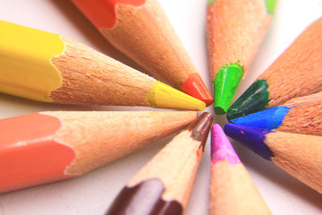 Macro photo of a collection of colored pencils on a white background