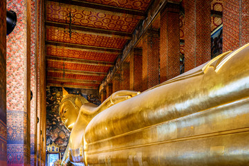 The Reclining Buddha at Wat Pho Temple, known as Temple of the Reclining Buddha (Bangkok, Thailand)
